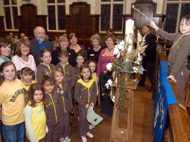 In 2007 Abbie Kingswood, right, a member of St Augustines Brownies lit the Shine Tree of Lights Candle at the ceremony held at Queen Elizabeths School
