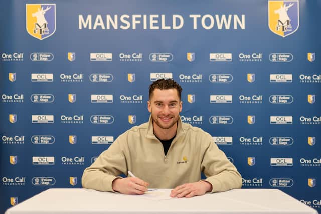 Harry Lewis signs for the Stags.