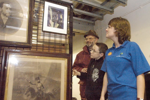 Jodi Henshaw, Mansfield Museum Development Officer, pictured with Barry Maddocks, left and Andrew Weston during a tour of the museum's store room.