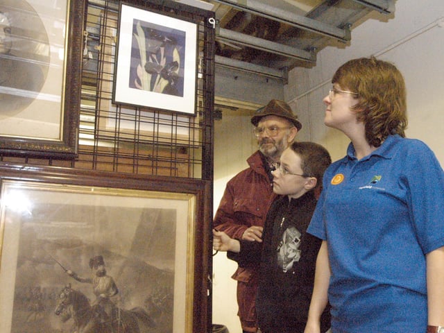 Jodi Henshaw, Mansfield Museum Development Officer, pictured with Barry Maddocks, left and Andrew Weston during a tour of the museum's store room.