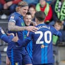 Ollie Clarke's first half goal celebrations with Aden Flint (14), Will Swan (26) and Tom Nichols (20) on Saturday as Stags won at Forest Green Rovers. Photo by Chris & Jeanette Holloway/The Bigger Picture.media
