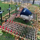 A MPCT student pays her respects to the fallen