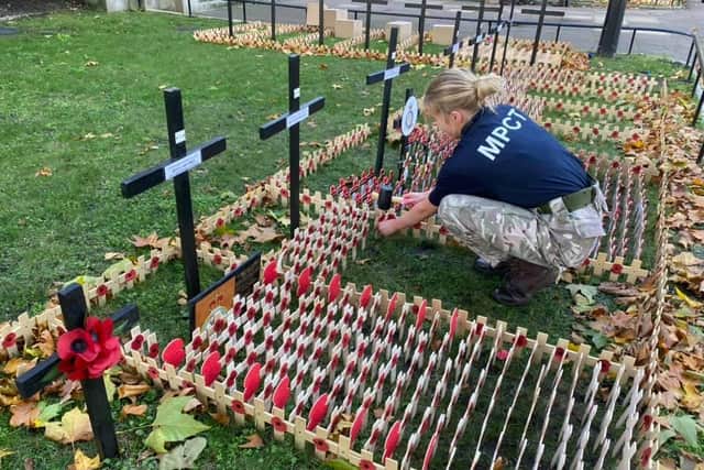 A MPCT student pays her respects to the fallen