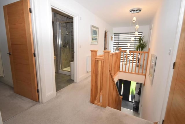 At the top of the stairs is this galleried landing, which guides you to all five bedrooms. A picture window at the front floods the whole of the first floor with natural light, while a walk-in cupboard offers lots of storage space.