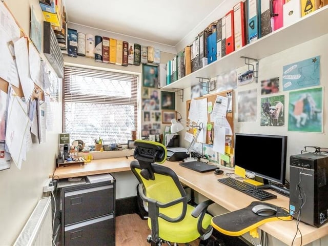 This busy, bustling office is a useful addition to the ground floor. It has a laminated floor and a double-glazed window facing the front of the Sutton property.