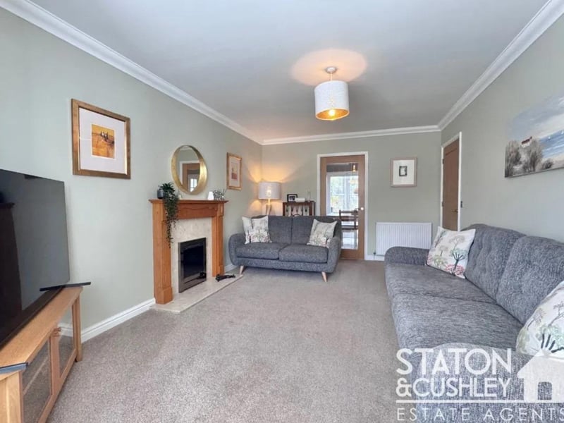 The warm and inviting living room is the perfect place to relax and unwind.