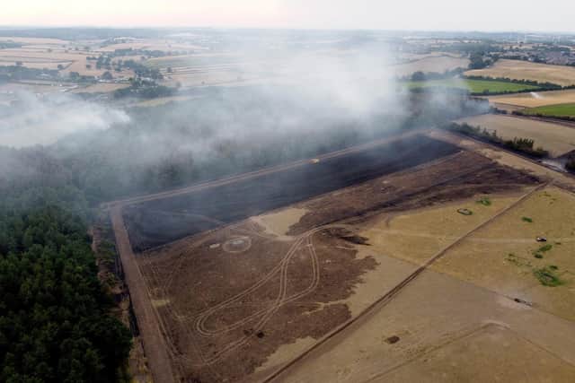 Smoke rises from the trees following the fire in Blidworth.
