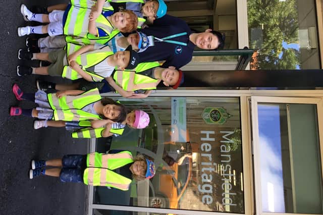 Staff and children outside Mansfield Woodhouse Library.