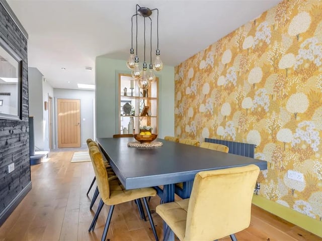 The dining room is perfect for family meals or entertaining guests and features a contemporary radiator and solid oak flooring.