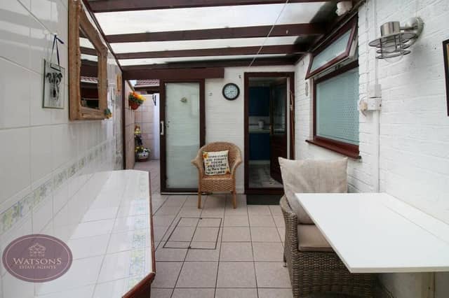 Squeezed within the layout is this quirky lean-to, with doors to the kitchen and rear garden.