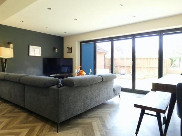 Here's that open-plan dining and living area, just off the kitchen. Comfort and style, don't you think?