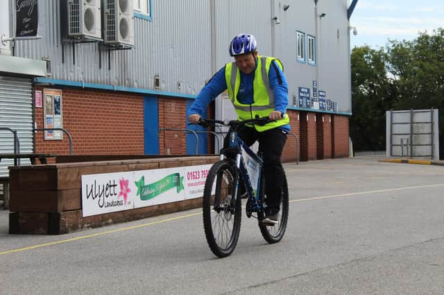 Gary Shaw, community manager of Mansfield Town Football in the Community, pedals to the One Call stadium.
