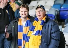 These Mansfield Town fans are pictured ahead of the 1-1 draw with Luton.