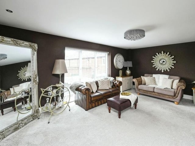 The unique luxury of the £400,000 Mansfield house is reinforced on the first floor, which is dominated by this marvellously presented, additional lounge. It has a double-glazed, full-length window facing the rear of the property and spot lighting.