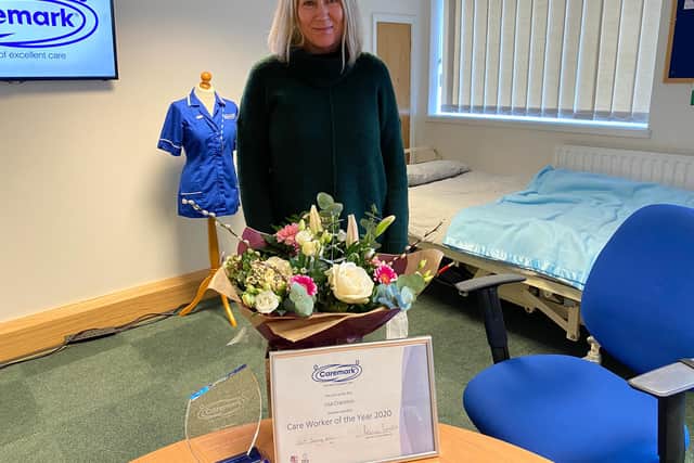 Lisa Cranston winning home carer for  Caremark (Mansfield and Ashfield) She was given flowers, a £100 gift token and the Hero in Blue award
