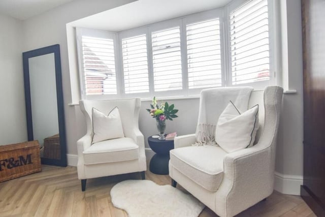The study or playroom at the £575,000 property has a relaxing area by the front window.