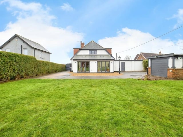The spacious lawned garden is perfect for families to enjoy outdoor activities.