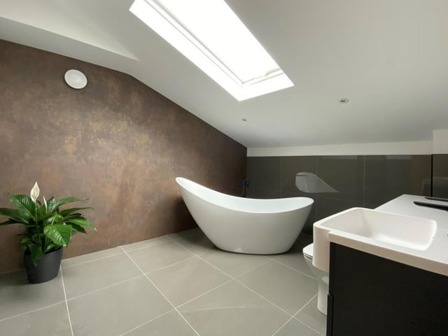 The bathroom on the first floor is bright and stylish. A modern three-piece suite boasts a free-standing bath, low-level WC and wash hand basin.