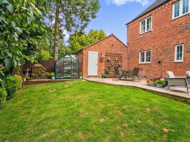 A second shot of the garden, which is mainly laid to lawn and is fully enclosed with a fenced boundary offering privacy. It also offers access to the garage