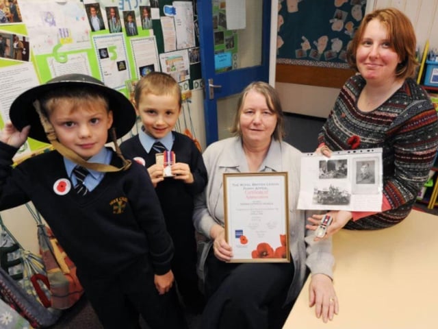 Remembrance Day activites at Holy Cross in 2013 with head teacher Pat Snowdon and class 1 teacher Donna Bradley.
