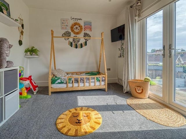 Here is the last of the five bedrooms, and the second of the pair on the first floor with access to a balcony.
