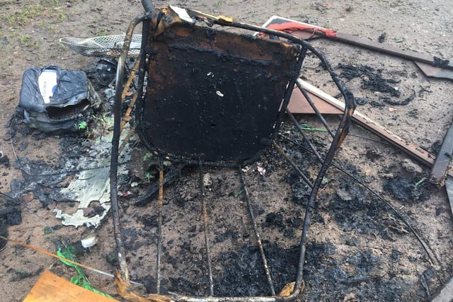 Burned out chair among fly-tipped rubbish in Deerdale Lane/Sherwood Pines forest area