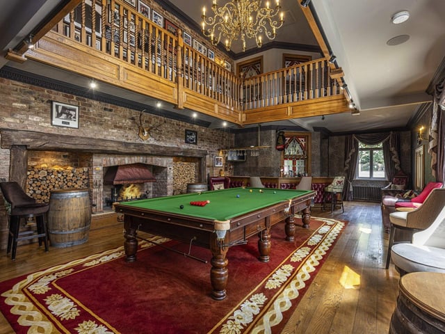 A sumptuous games room gives a further entertainment area, with space for a snooker table and fully functioning bar. There is a galleried landing area above which provides a spectacular vantage point to take in the antics below.