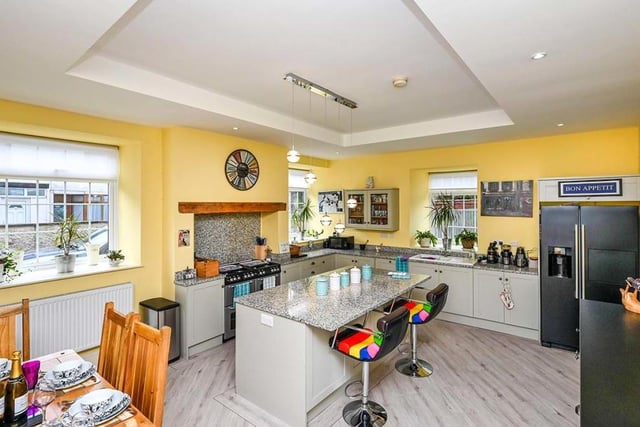 The kitchen/dining room is a spectacular sight, with a modern range of units and an island taking centre stage. Integrated appliances include a New World Aga-style range cooker, a dishwasher and a concealed Worcester combination boiler, fitted in 2019. The flooring is Karndean and there are windows to the front and side of the cottage.