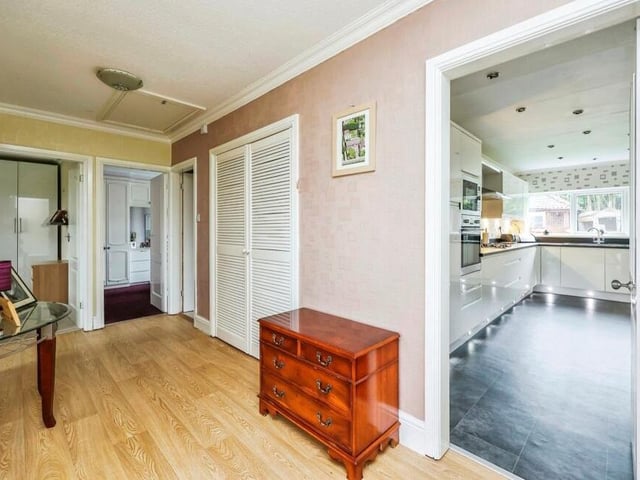 This welcoming, good-sized hallway links all the rooms at the £375,000 bungalow. It boasts a vinyl floor and an airing cupboard.