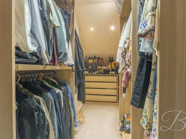 Here is the walk-in wardrobe that is part of the master bedroom on the first floor.