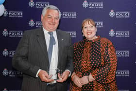Andy Guy receiving his award from Caroline Henry, Nottinghamshire police and crime commissioner.