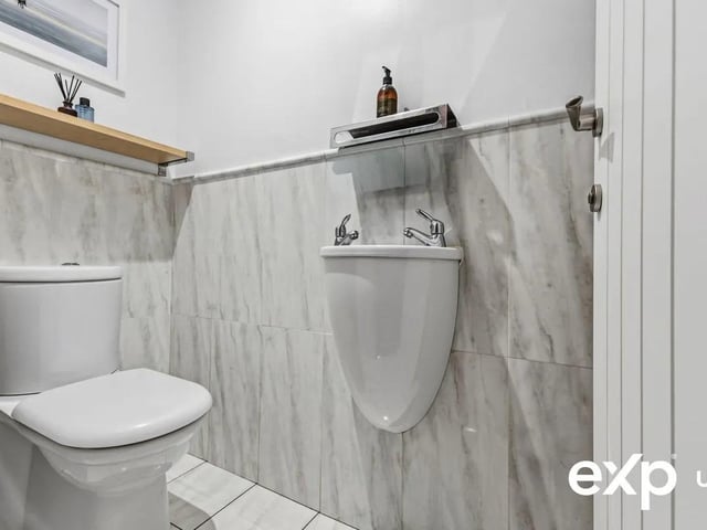 The ground floor benefits from a convenient cloakroom fitted with a modern suite comprising a washbasin and a low-flush w.c.