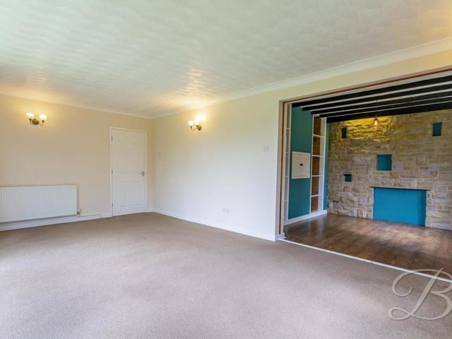 How the large lounge gives open access to the dining area at the Kirkby bungalow.