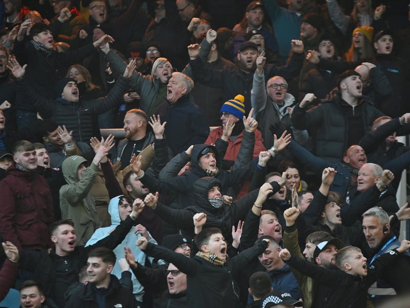 Mansfield Town fans watch the brilliant win at Peterborough United.