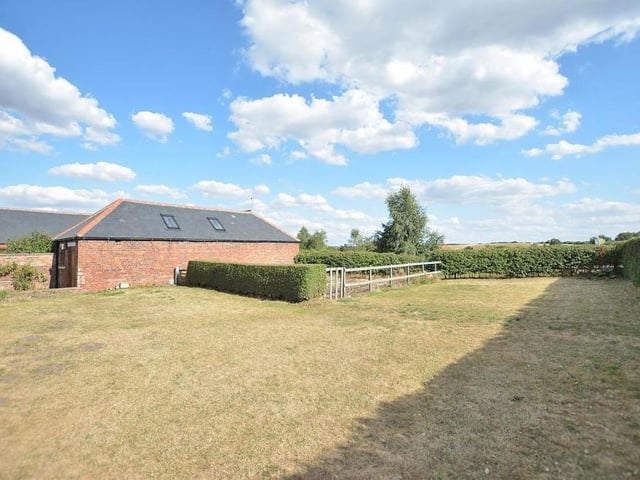 This image shows how extensive the gardens are, mainly laid to lawn but also with a vegetable plot.