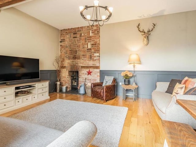 The lounge invites you to spend an evening relaxing in front of the telly and the fire. Adding to the warmth is underfloor heating.