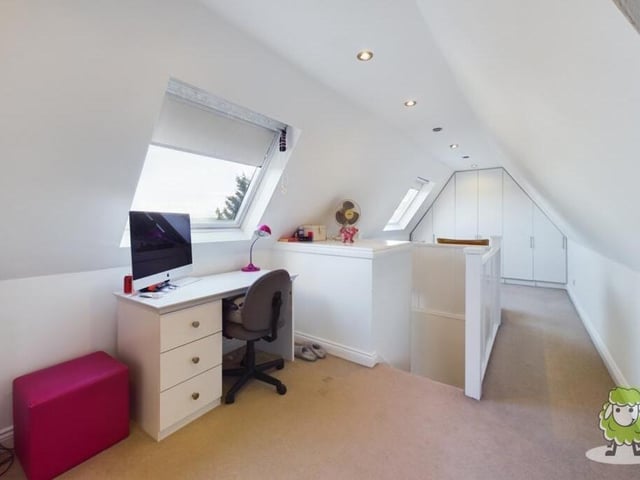 ......And in another part of the second-floor bedroom is this desk space for gaming. Add the two together and it's the perfect retreat for a growing teenager.