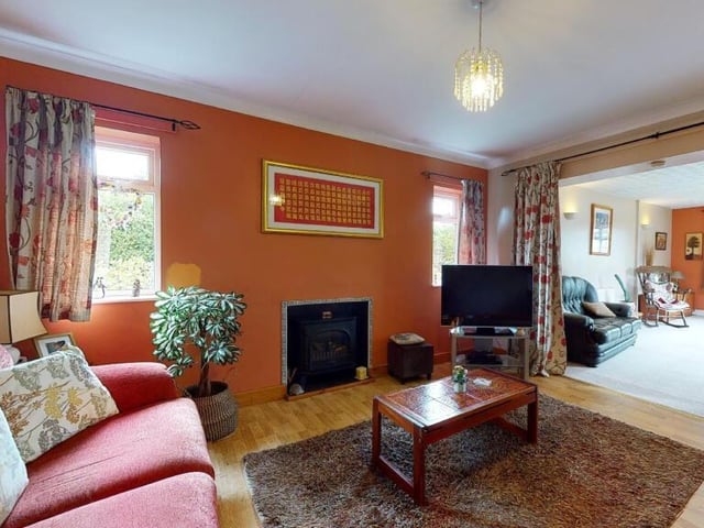 Let's begin our tour of the Selston bungalow in the lounge, which is open plan and leads seamlessly to the sitting room or family room to the right.