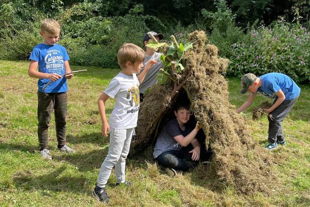 Den-building fun for children at one of the Rika Bushcraft sessions.