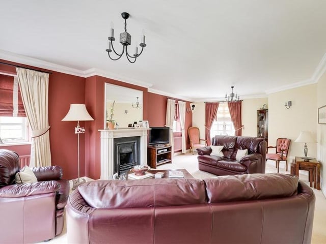 A second shot of the first-floor living room, which boasts space and comfort in equal measure. There's a TV point and three radiators.