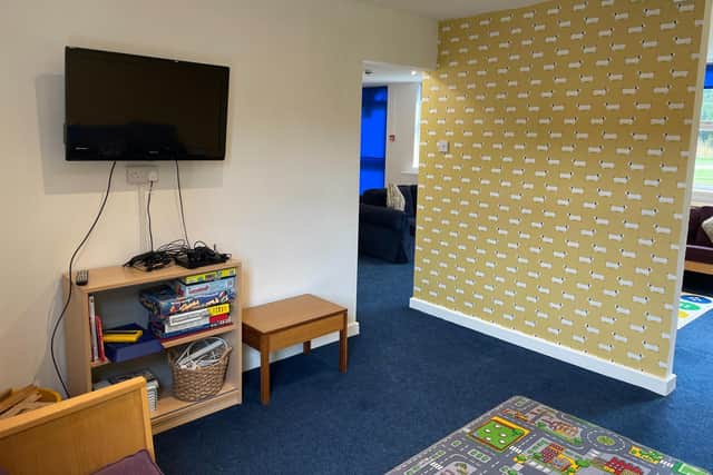 The newly decorated lounge at Dawn House School at Rainworth now features colourful wallpaper featuring sausage dogs! The work was done by a volunteer team of residential support workers during the holidays.