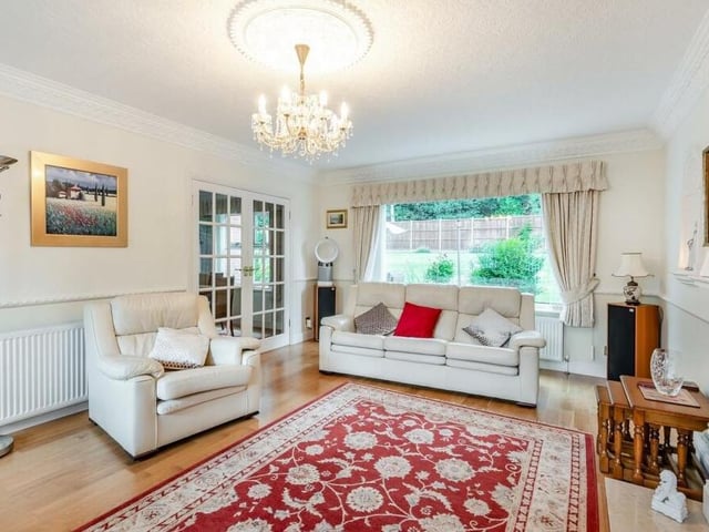 The lounge offers an abundance of home comforts. Other features include coving to the ceiling, a wood floor, a dado rail and a wall-light point above the fireplace.