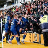 Mansfield Town's players celebrate their goal at Newport with the away fans in Saturday's controversial clash - Photo by Chris Holloway/The Bigger Picture.media