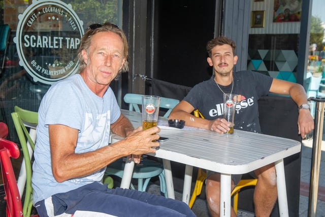 Steve Lewis and Mike Nunn enjoying a cold drink outside Scarlet Tap, Southsea. Picture: Habibur Rahman