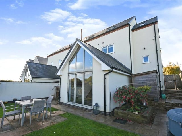 A striking feature of the Kirkby home is this beautiful glass window at the back. You can see why the property was originally chapel-designed.