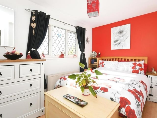 Bedroom number two overlooks the back of the £290,000-plus property. Bright and colourful, it has lots of built-in storage, as well as space for a double bed.
