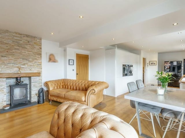 We launch our tour of the £535,000-plus Mansfield bungalow in the main reception room, which is the living room/diner. It features an attractive log-burner, and there is ample space for a dining table.