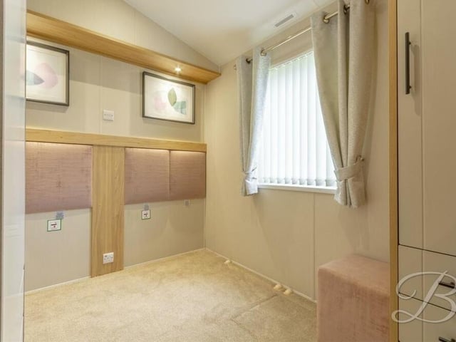 Bedroom number two at the Old Mill Lane home is also well proportioned, with a window facing the side.