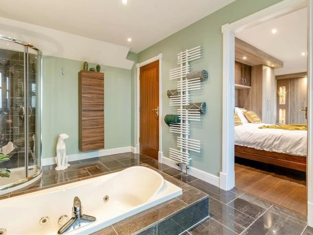The family bathroom on the first floor also acts as a Jack and Jill en suite to the master bedroom. A modern, four-piece white suite with chrome fittings consists of a sunken spa bath-tub, separate shower enclosure, vanity unit with inset wash hand basin and low-flush WC. The attractive, tiled floor is a real plus.