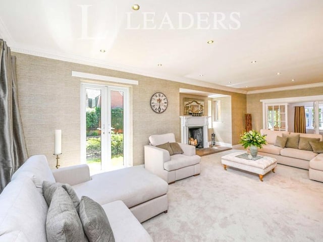 This second shot of the drawing room gives you a sense of its size and comfort. French doors lead outside to the side of the property, while double doors lead to the sitting room.